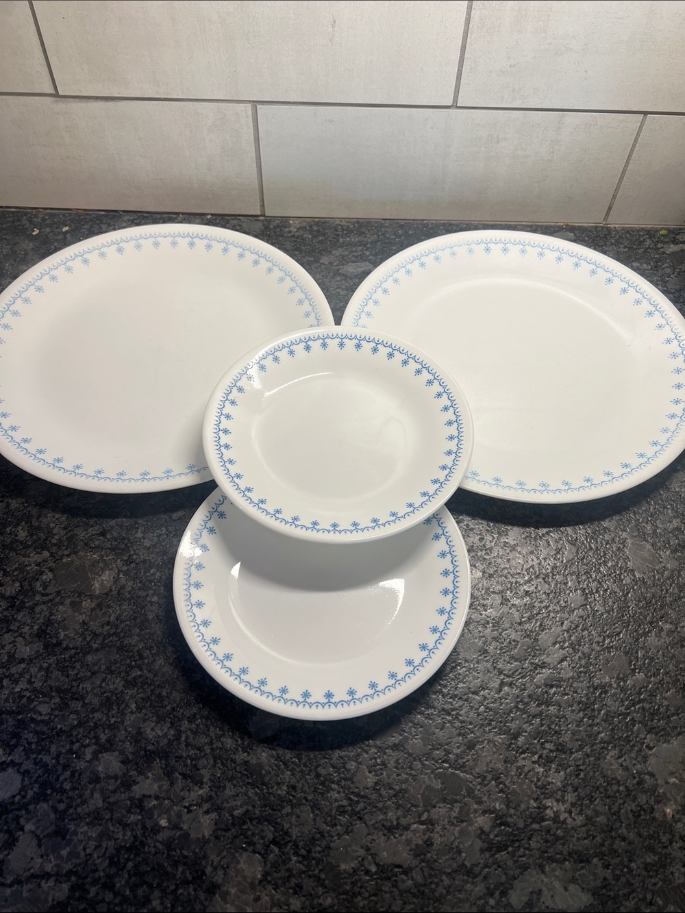 4 piece set of Corelle Dinner plates and salad plates. Snowflake Blue